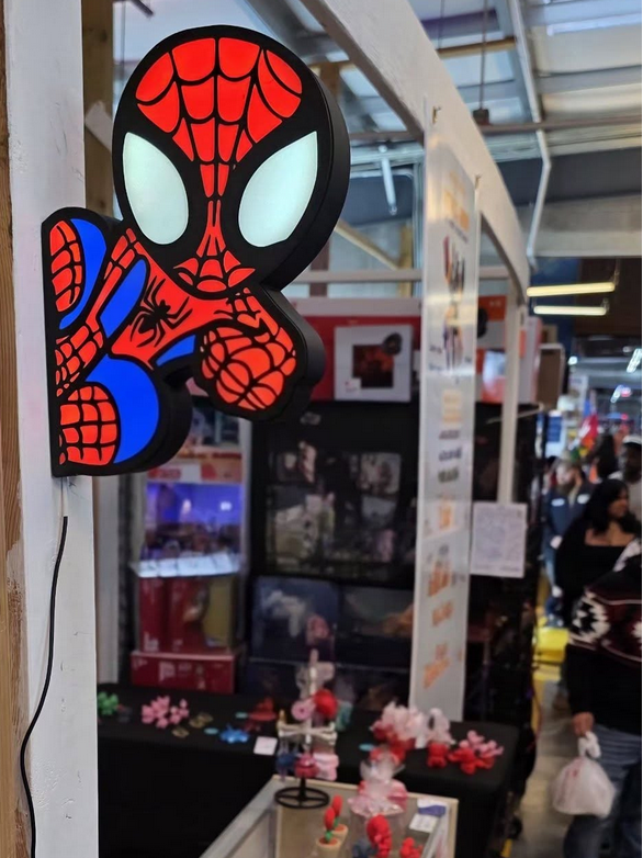Spider-Man themed light fixture in a store setting