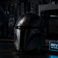 Darkly lit room with a helmet and neon sign on a shelf